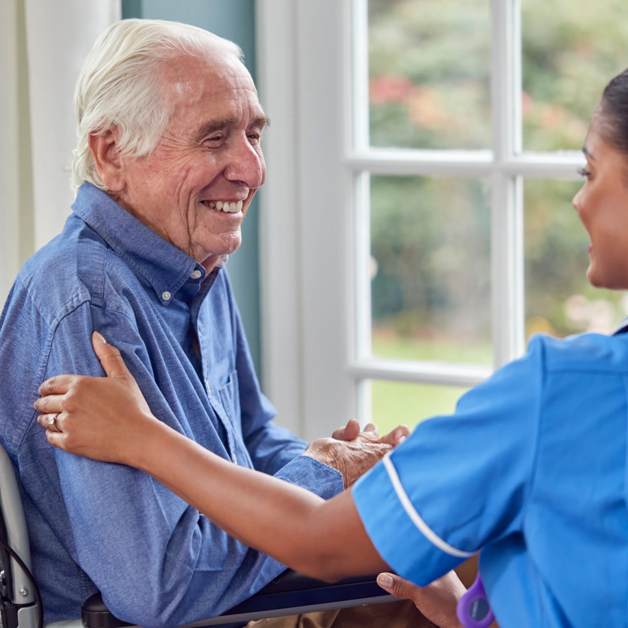 Resident being supported by a carer